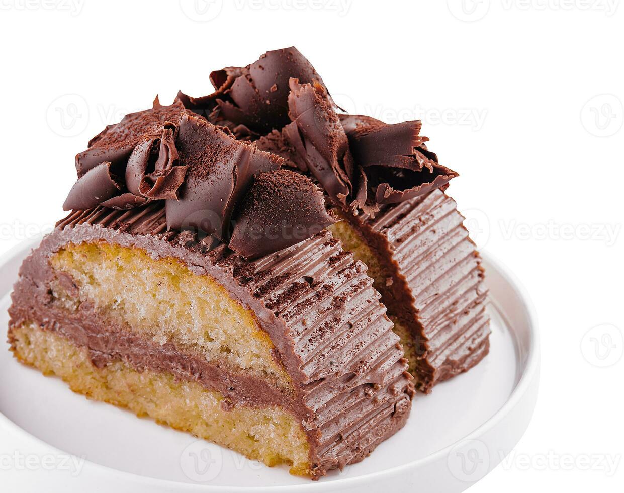 Chocolate roll with cream on a white plate photo