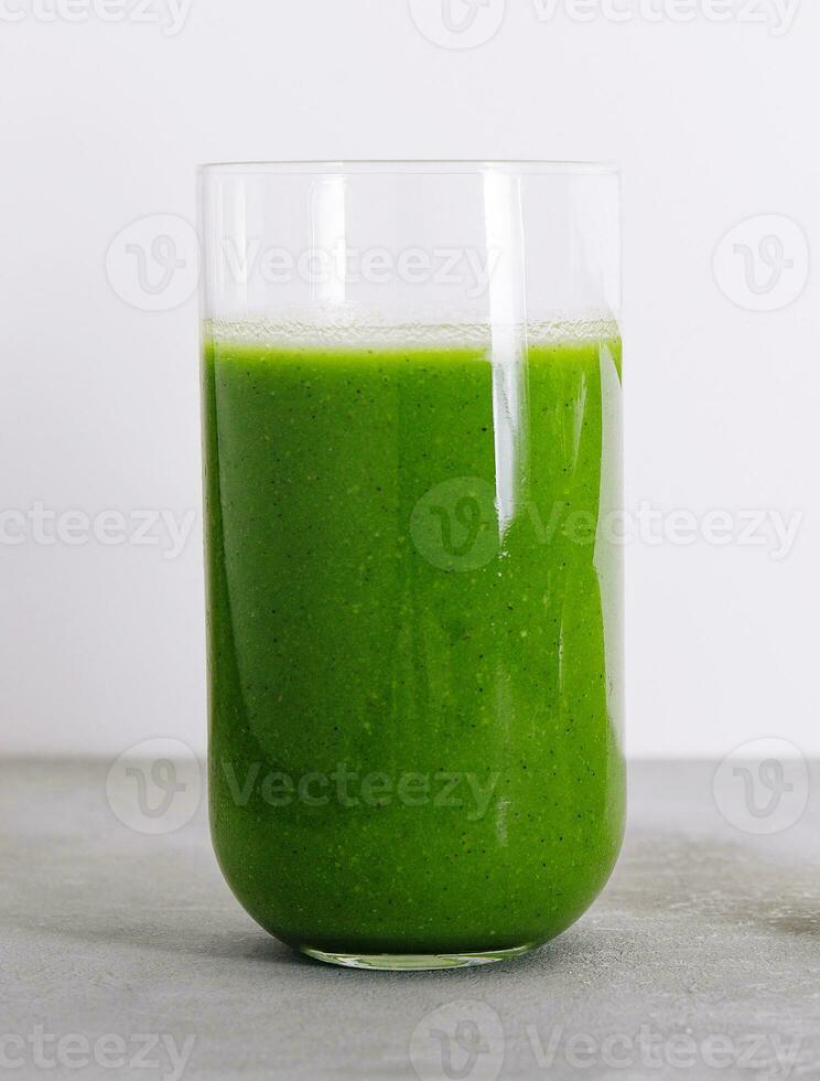 Kiwi smoothie on stone table close up photo