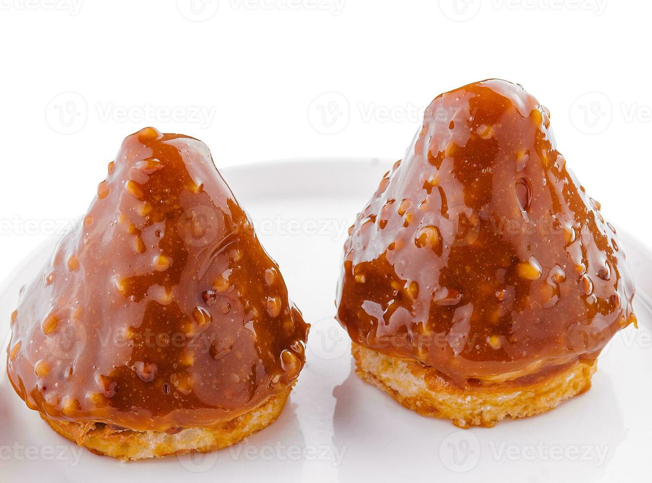 triangular cake with toffee jam on plate photo
