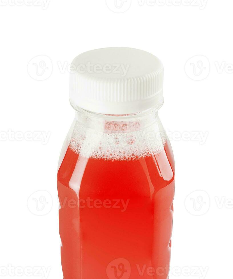 plastic bottle with red juice on a white photo