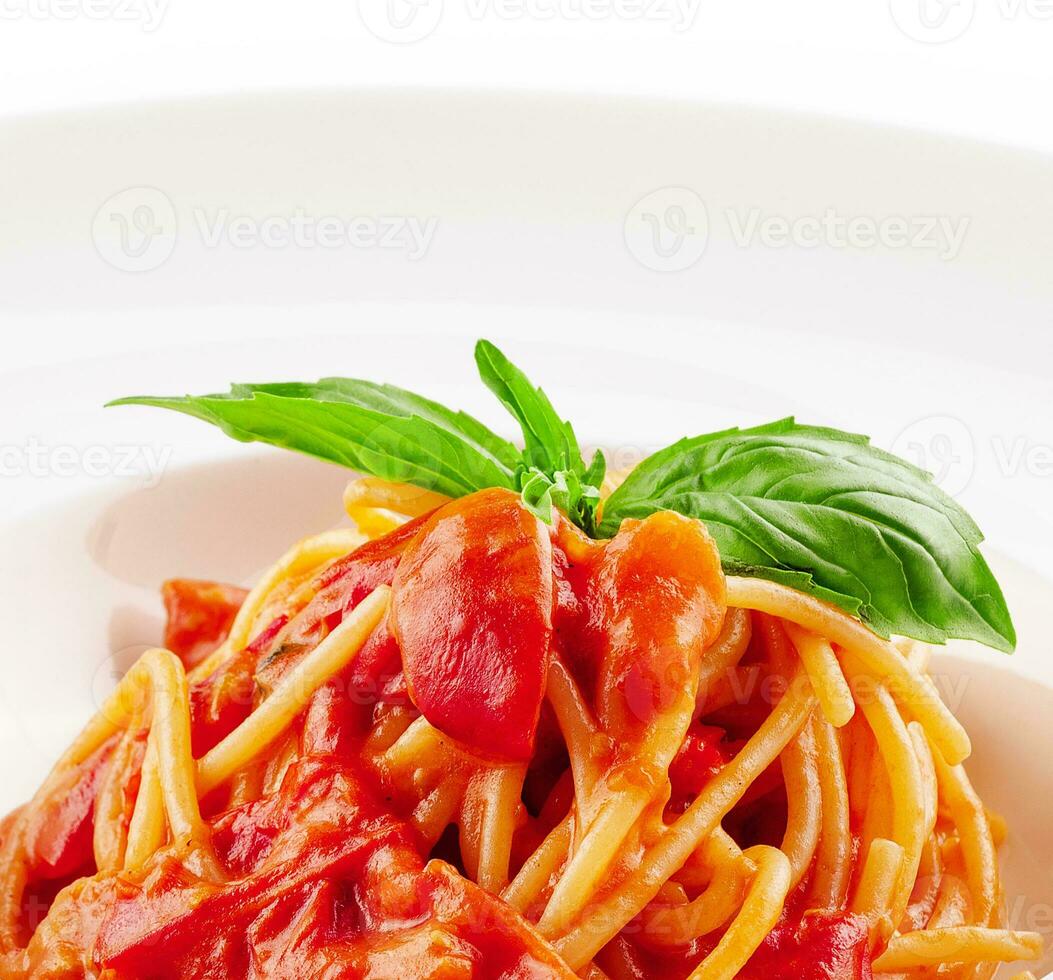 Spaghetti with tomato sauce and cherry tomatoes with basil photo