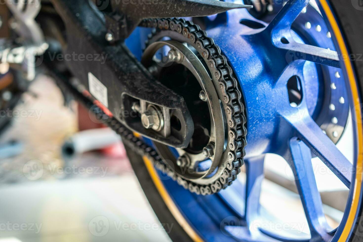 motorcycle chain and sprockets in sport bikes at garage, service and maintenance concept photo
