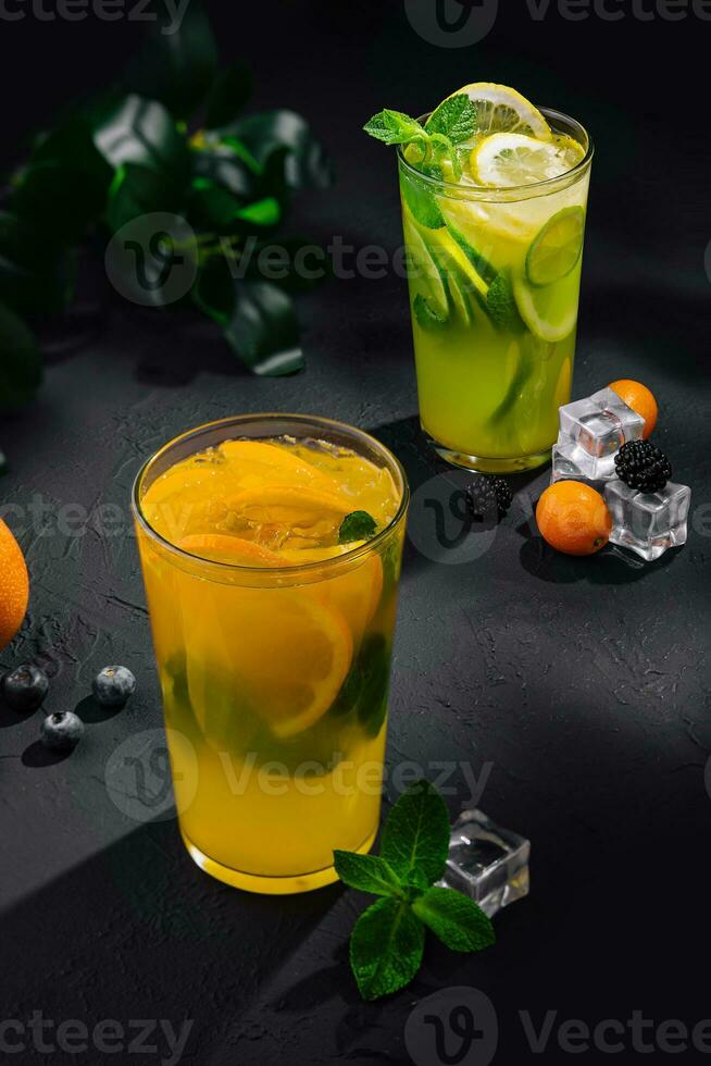 Refreshing lemonade with orange, lime and mint photo