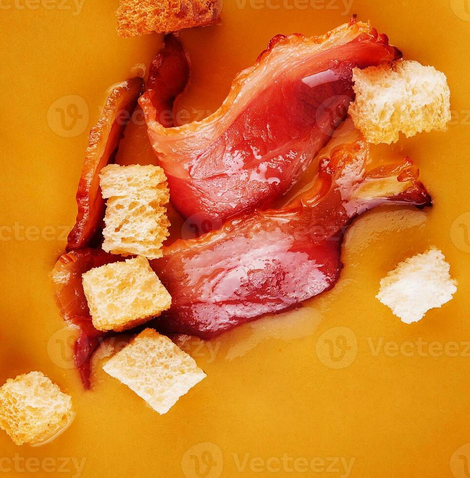 Cream of pumpkin soup with bacon photo