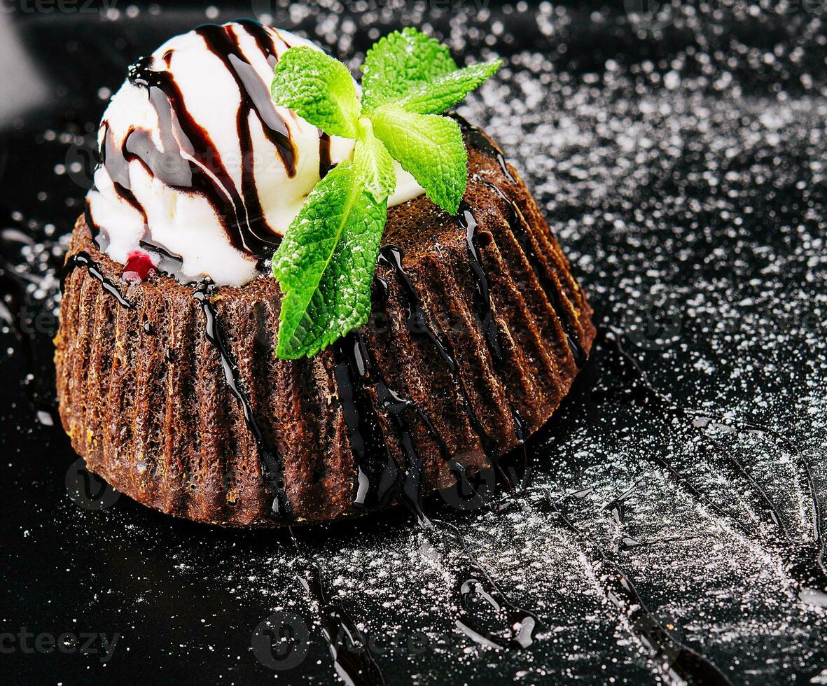 Chocolate brownie with vanilla ice cream photo