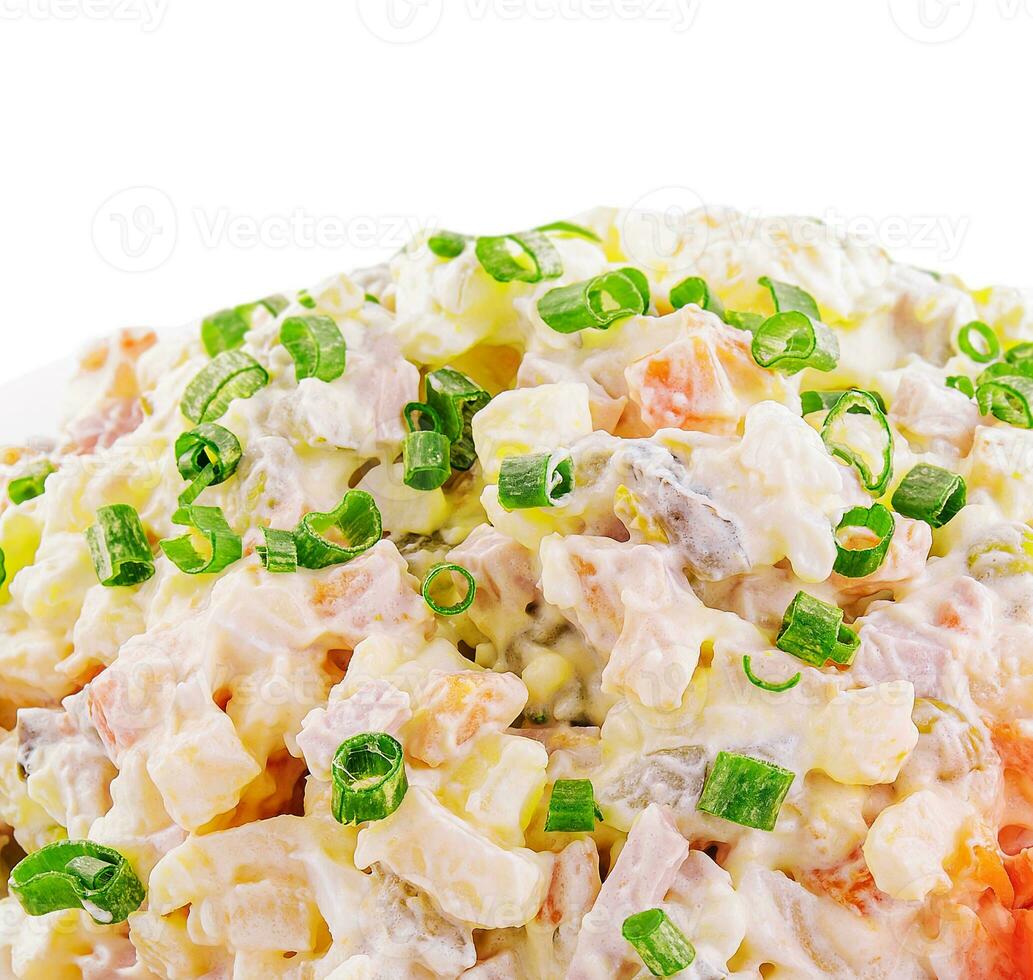 Olivier salad, isolated on white background photo