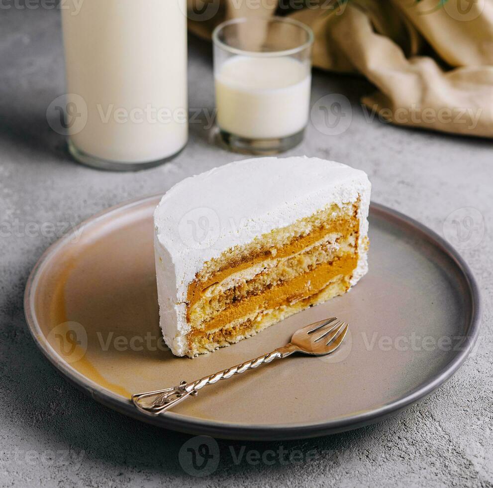 Delicious cake with whipped cream and caramel filling photo