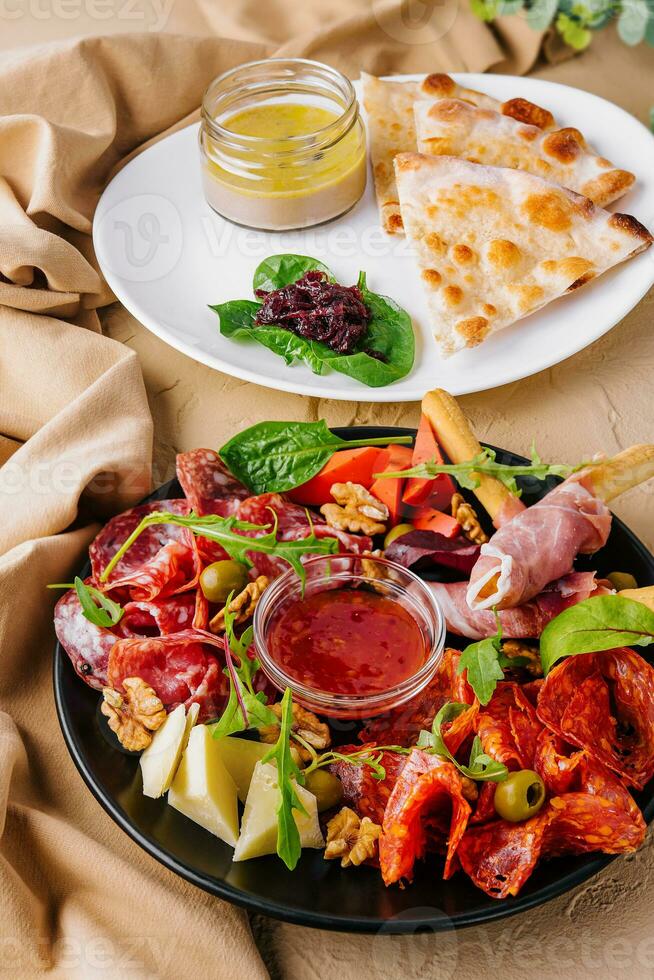 Appetizers table with antipasti snacks photo