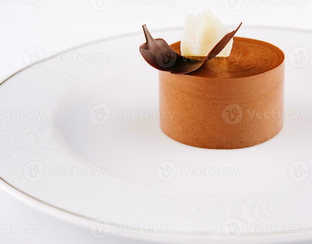 Plate with coffee panna cotta on white photo