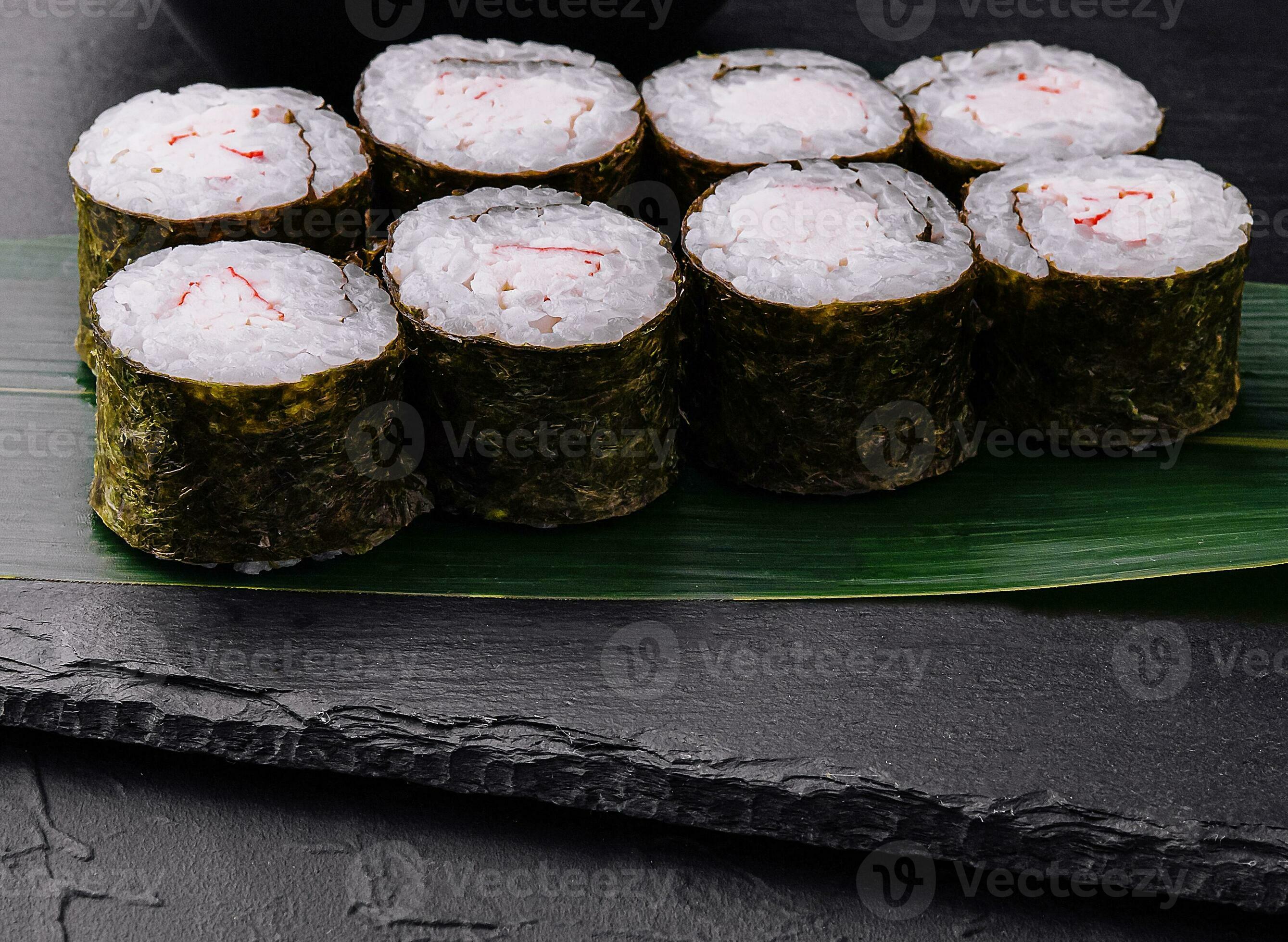 Crab stick maki sushi on black tray 34755184 Stock Photo at Vecteezy