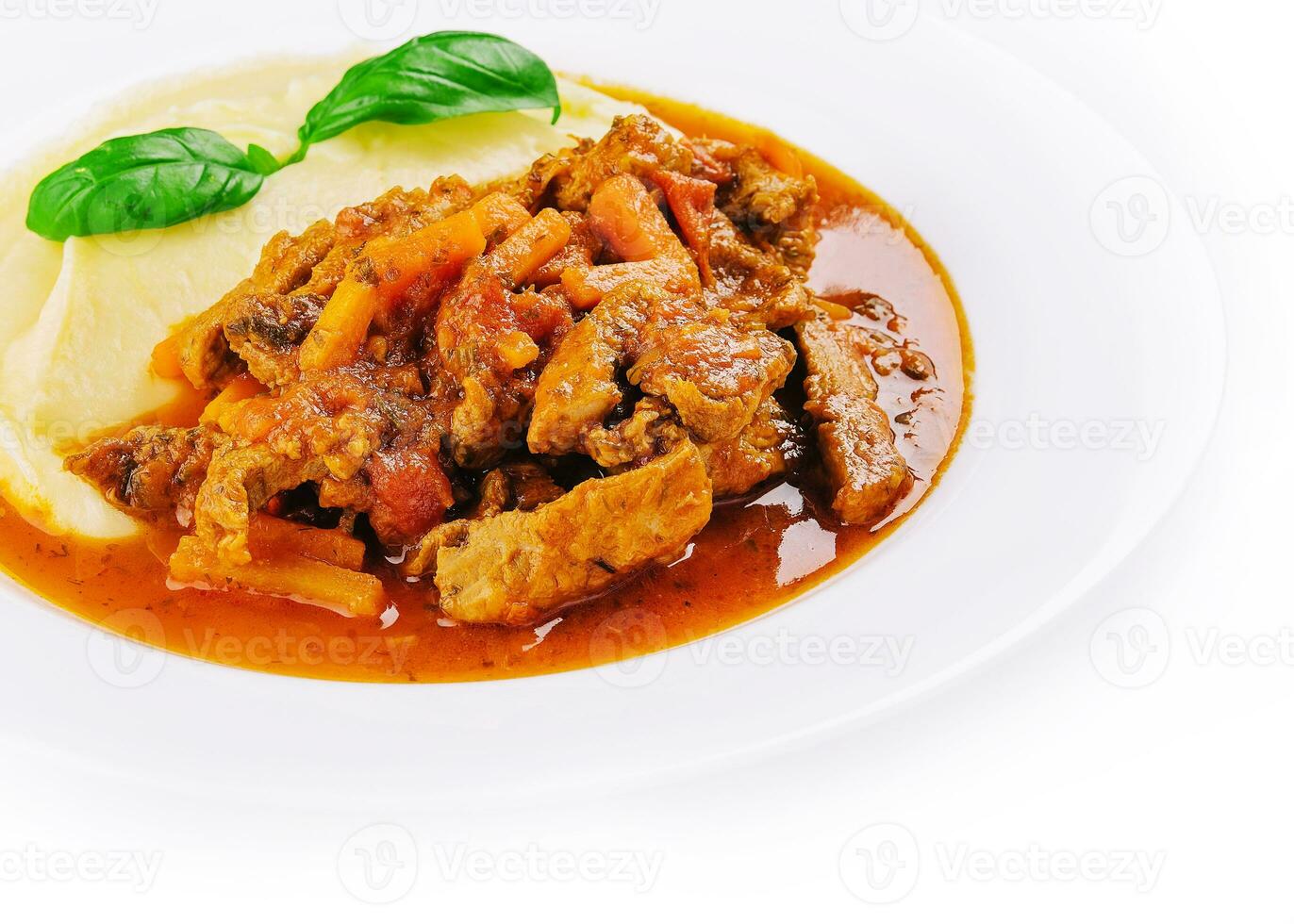 lunch with beef bourguignon stew served with mashed potatoes on a plate photo