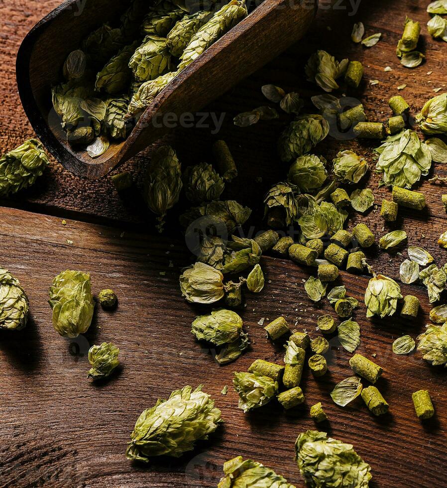 Fresh green hops on wooden table photo