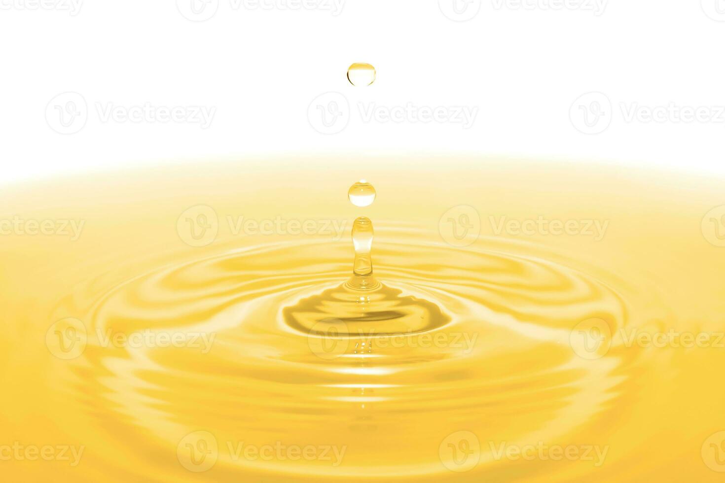 Drops of water hitting the water surface. Close-up view photo