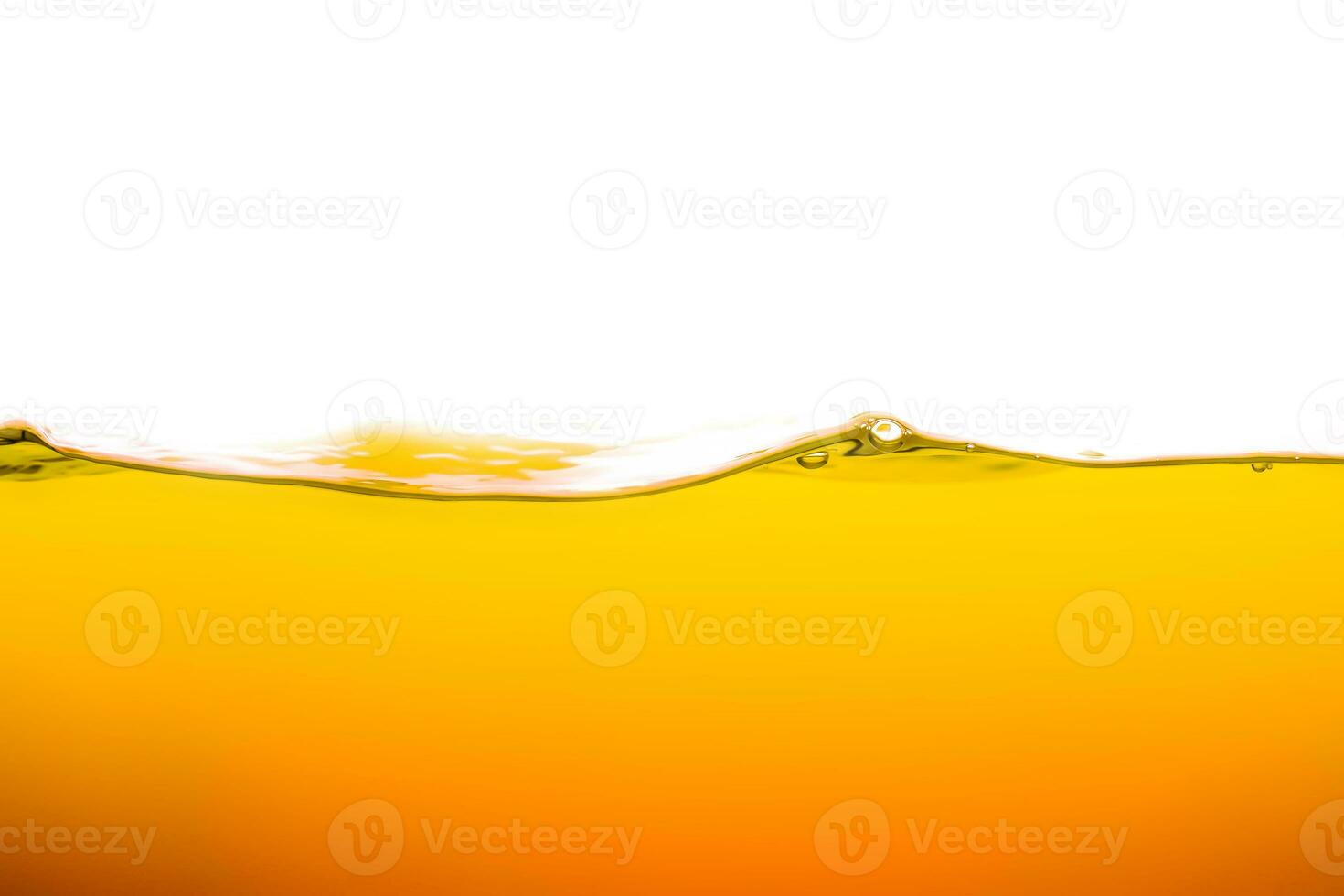 orange juice is isolated on white background. healthy fresh drink and natural waves. close up view. photo