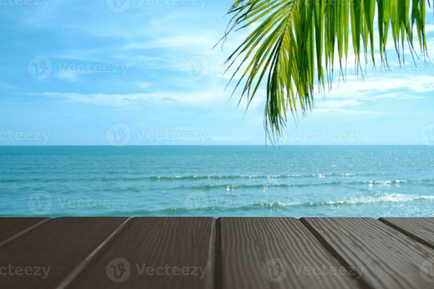 Beautiful foreground wooden floor and blue sea and sky background. photo