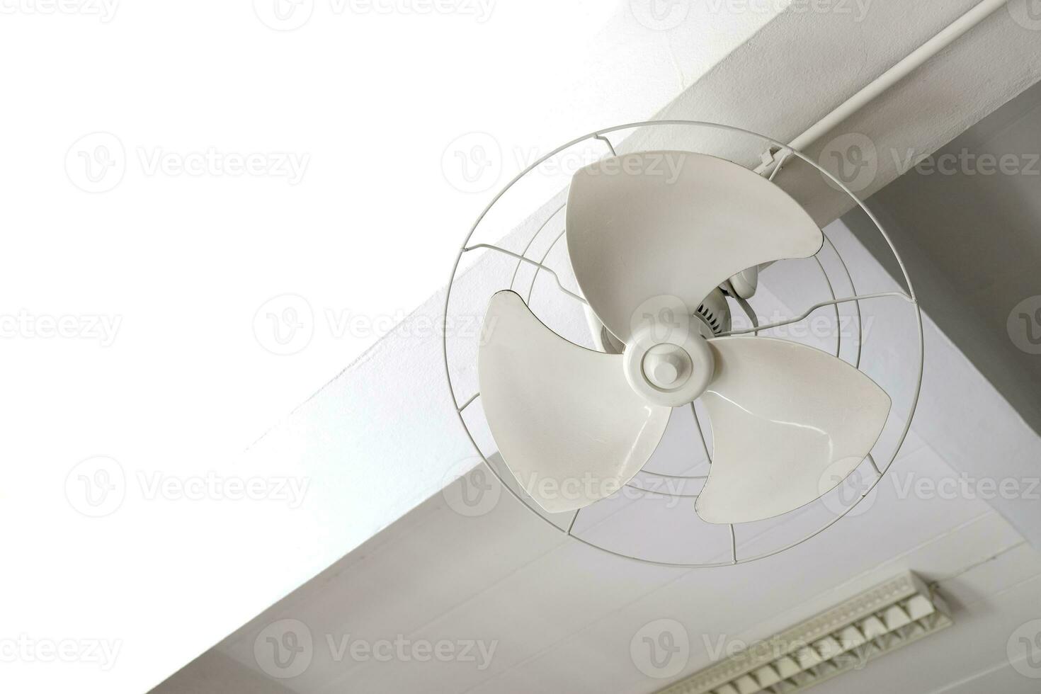 Electric ceiling fans in an incomplete condition inside a building. photo