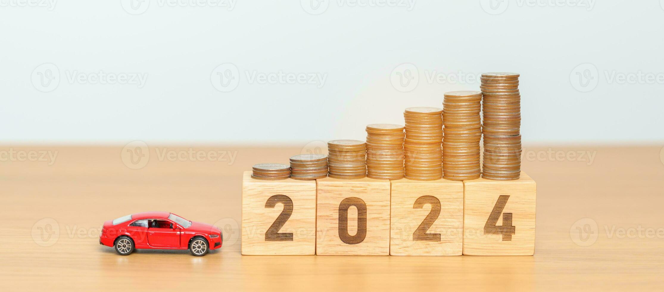 2024 year block with car model and Coins Money stack for deposit and Automobile Tax. Money Saving, Car Insurance, Financial, vehicle Repair and Maintenance and New Year concept photo