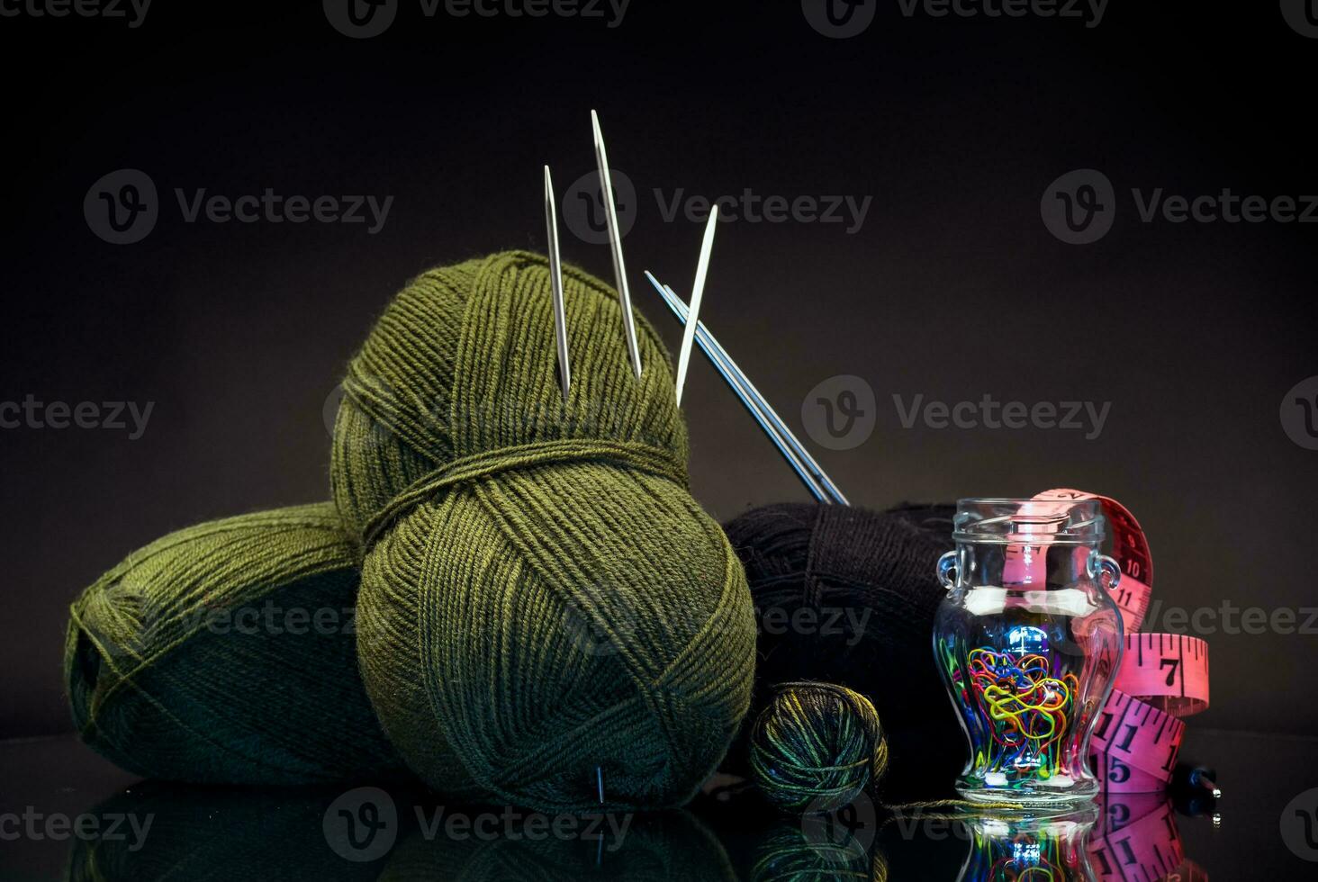 wool yarn, knitting needles and other tools for hand knitting. photo