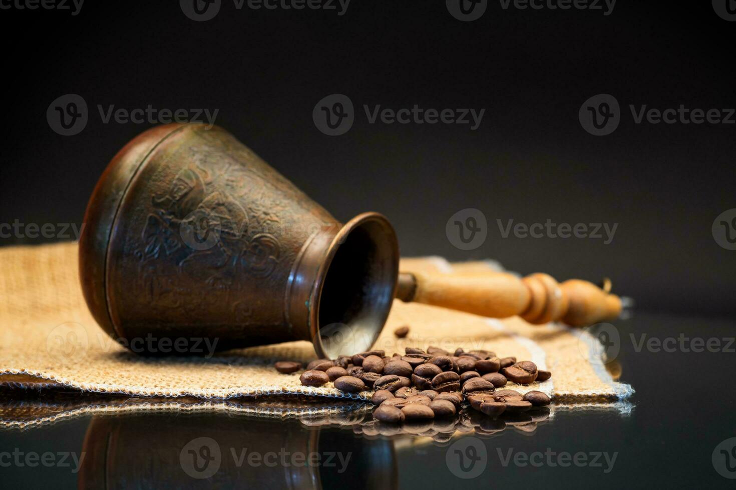 natural coffee beans, Turkish coffee pot on burlap photo