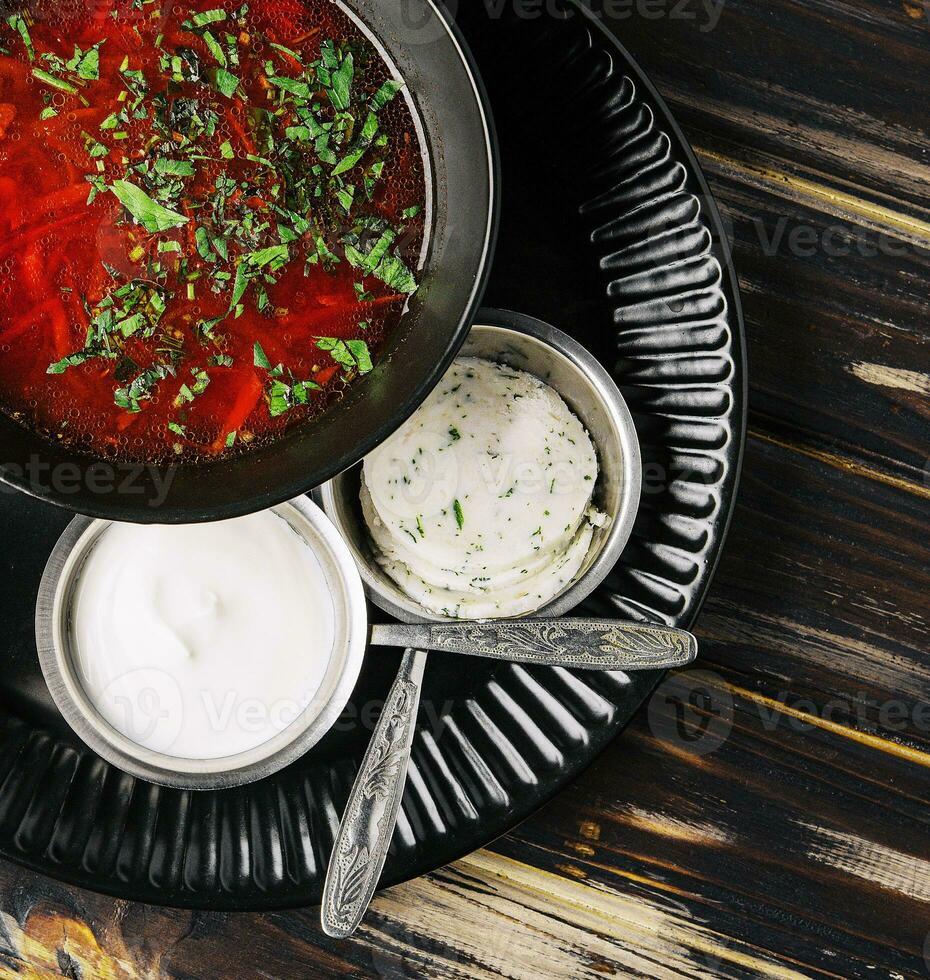 Ukrainian cuisine - borscht with sour cream photo