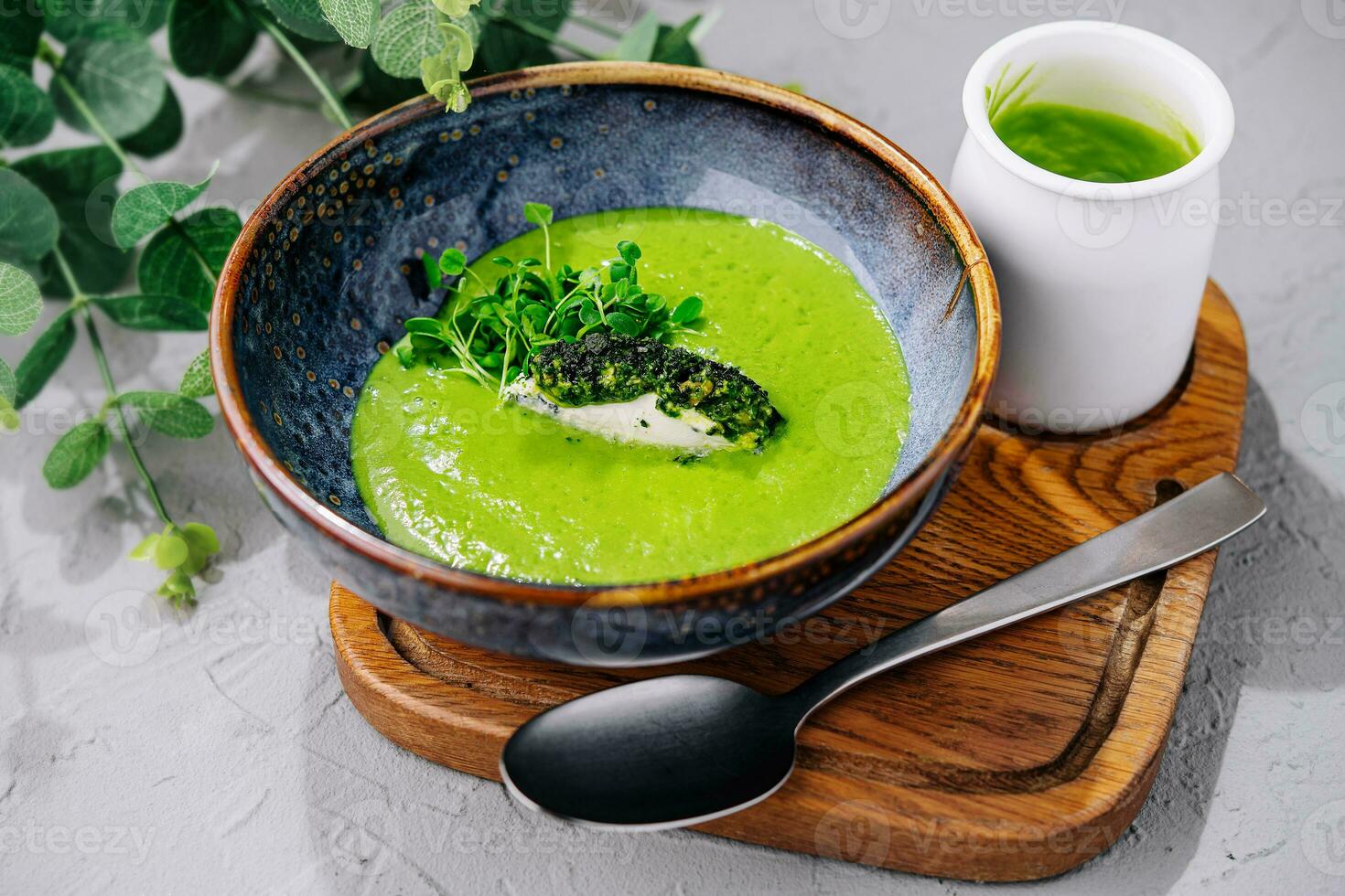 Broccoli, spinach cream soup in a bowl photo