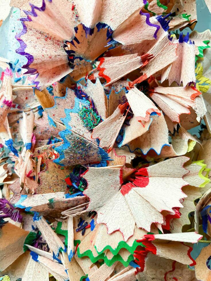 shavings and pieces of lead on paper after sharpening pencils, preparing pencils for use in teaching photo