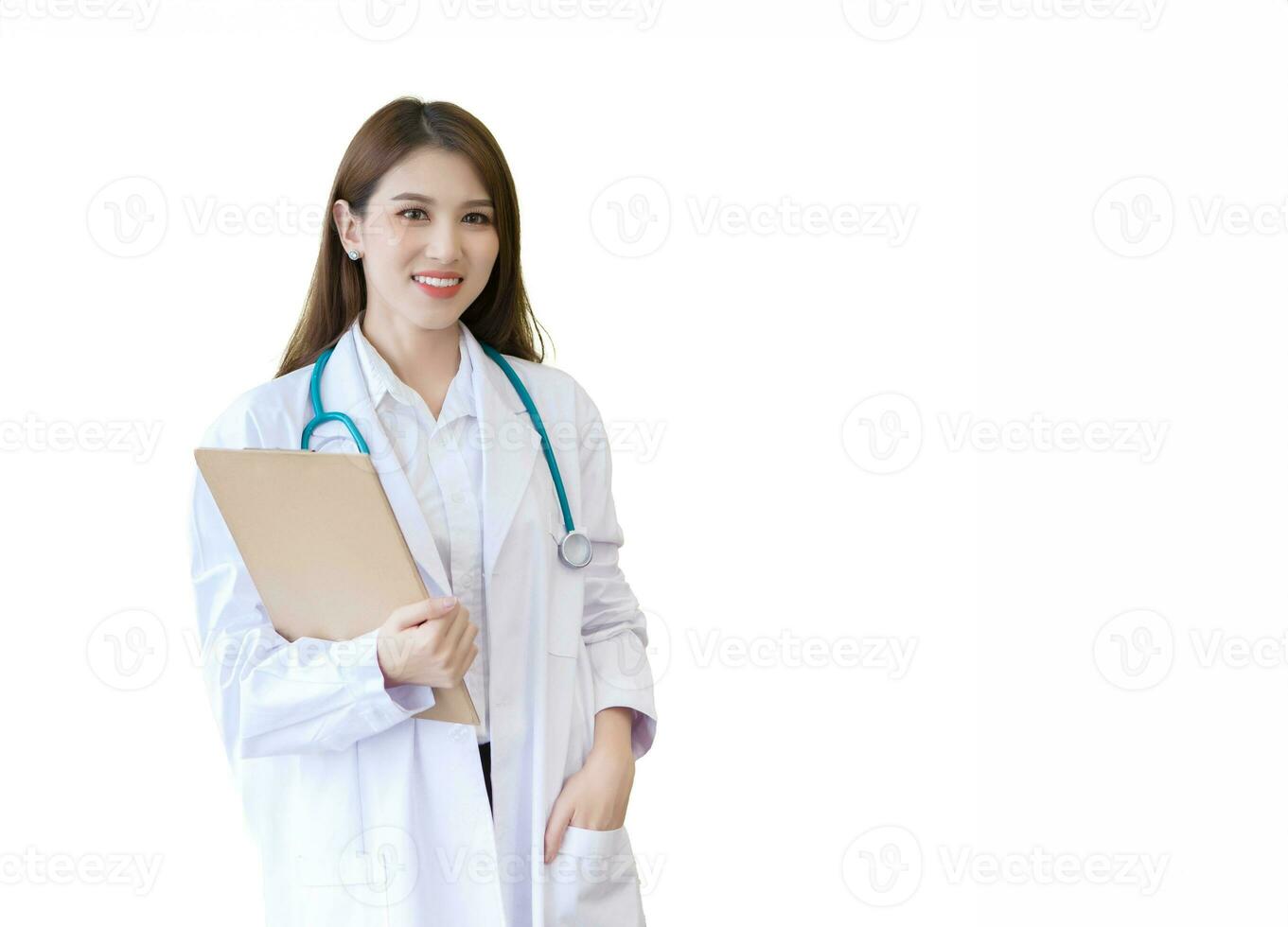 Young professional Asian woman doctor wears medical  white lab coat stand and hold clipboard in her hand at work office in hospital. Coronavirus protection concept. photo