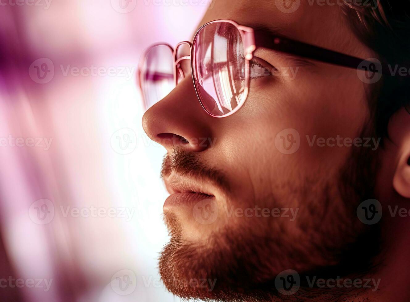 AI generated A young man looks up through his glasses. AI generated. photo