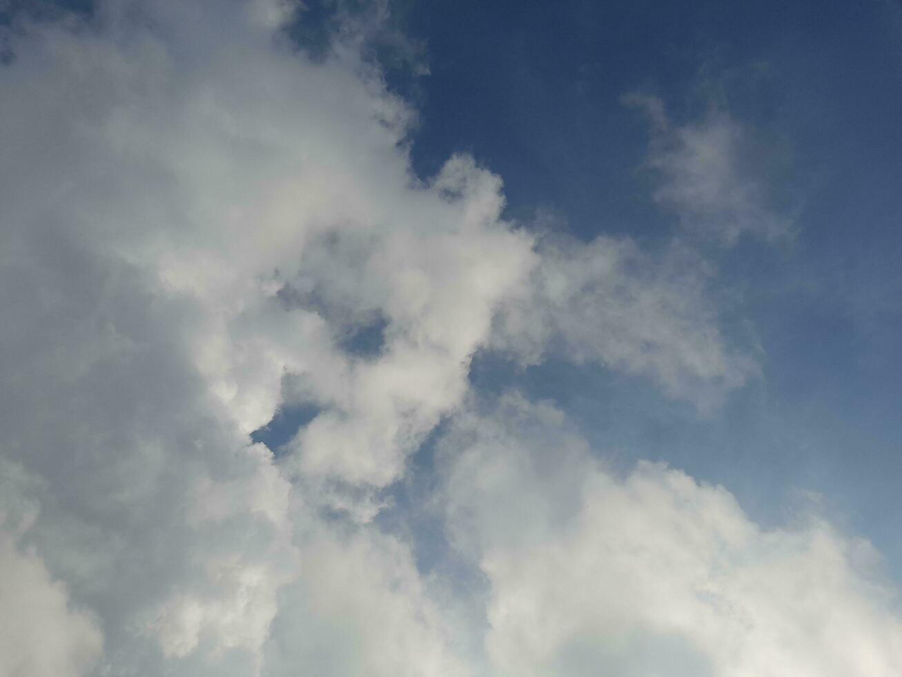 The white clouds on the blue sky are perfect for the background. Skyscape on Lombok Island, Indonesia photo