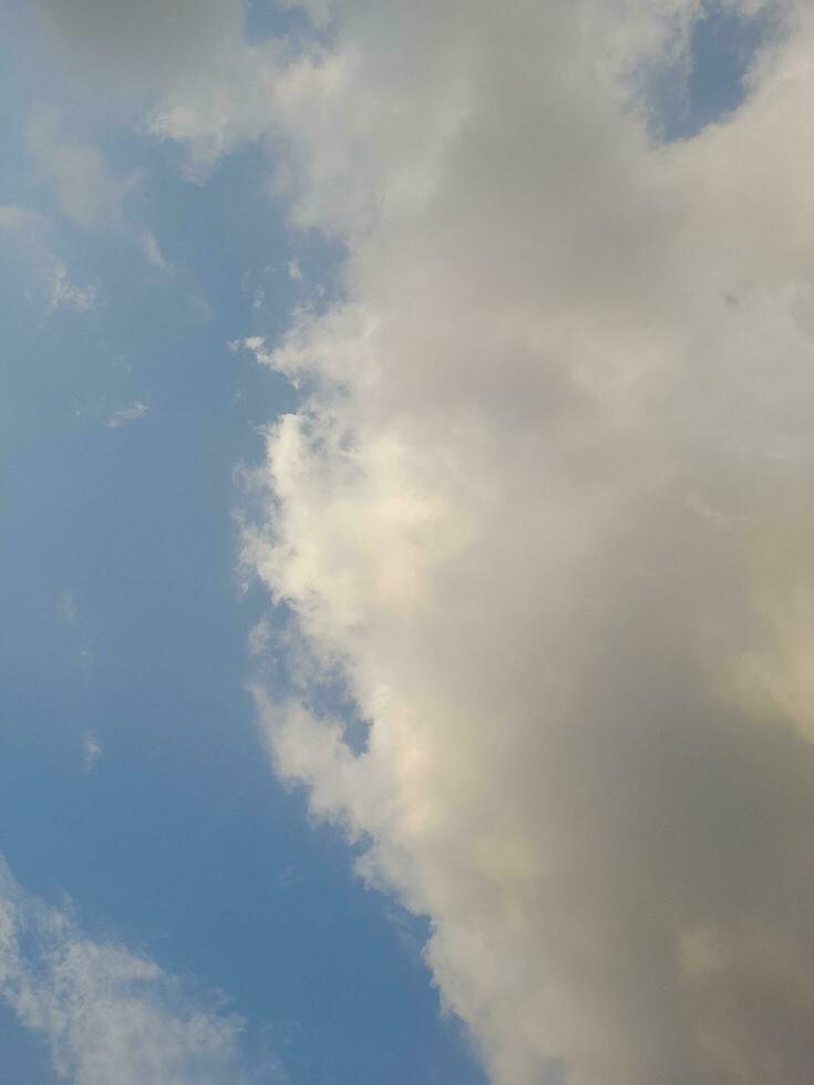 Beautiful white clouds on deep blue sky background. Large bright soft fluffy clouds are cover the entire blue sky. Skyscape on Lombok Island, Indonesia photo