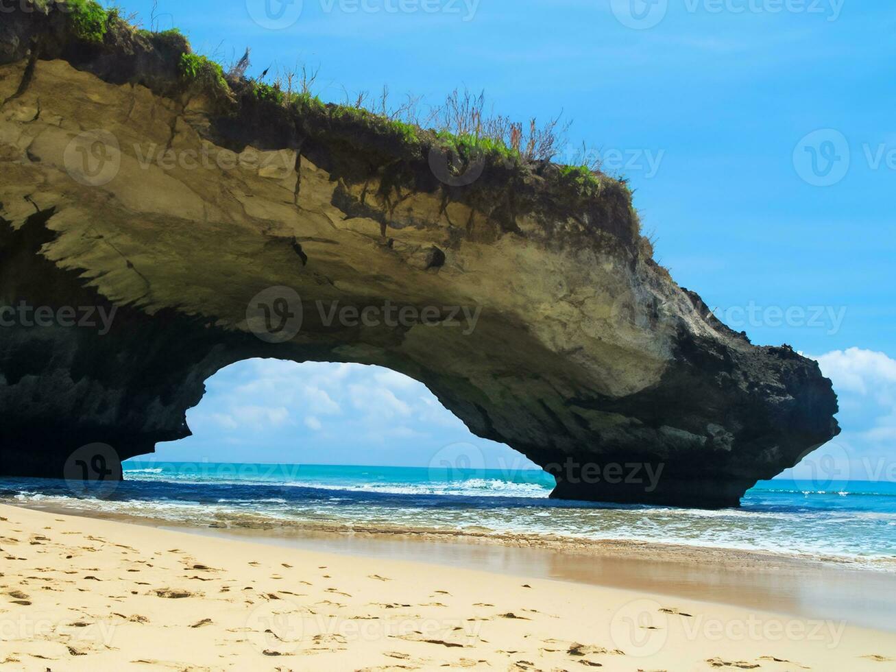 beautiful tropical beach with blue ocean and rocks photo