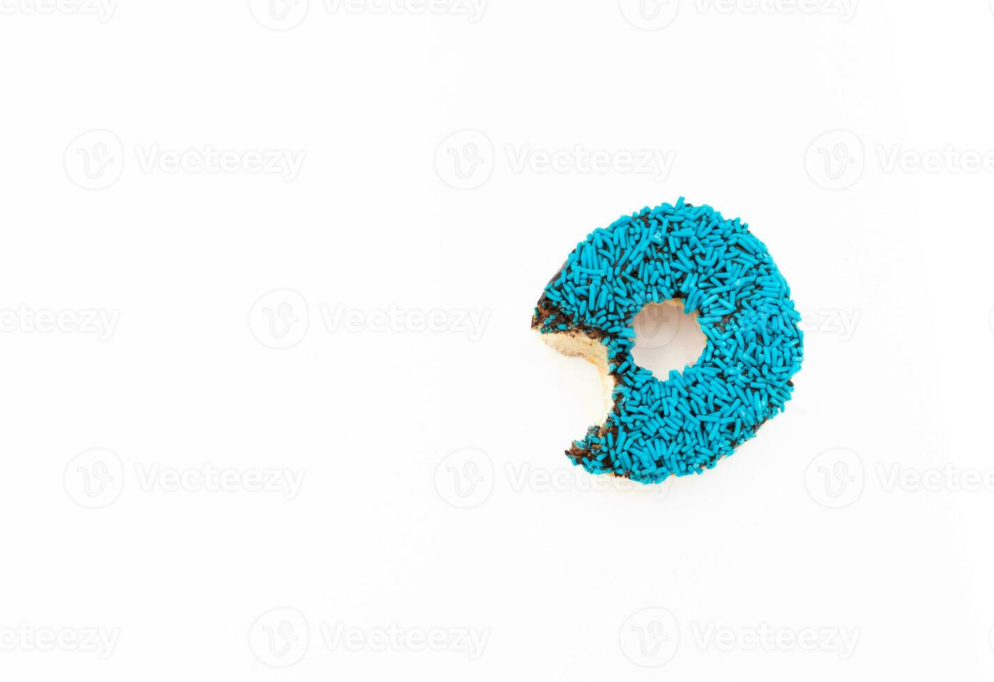 Donut with blue sprinkles isolated on white background. After some edits. photo