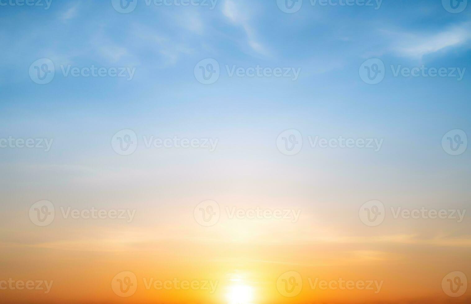 Real amazing Beautiful sunrise and luxury soft gradient orange gold clouds with sunlight on the blue sky perfect for the background, take in everning, Twilight sunset sky with gentle colorful clouds photo