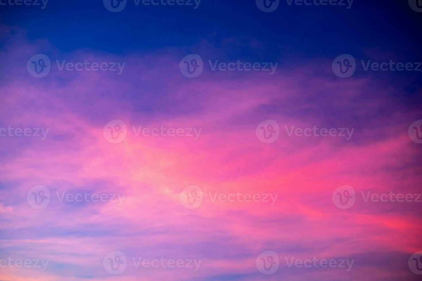 Beautiful sunrise and luxury soft gradient rainbow clouds with sunlight on the golden pink patelperfect for the background, take in everning, Twilight sunset sky with gentle colorful clouds photo