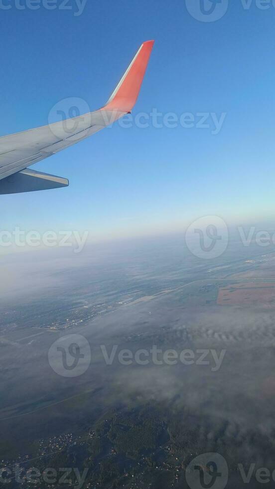 airplane wing, airplane flight. it can be used for posts and stories, used as a background for design photo