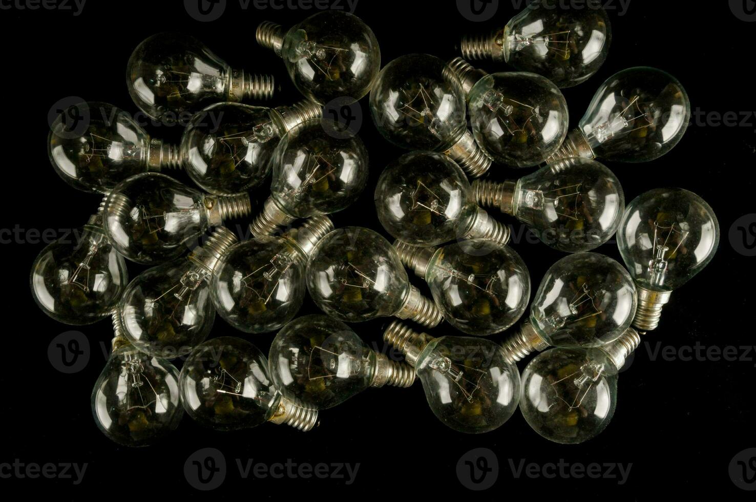 a pile of small bulbs on a black background photo