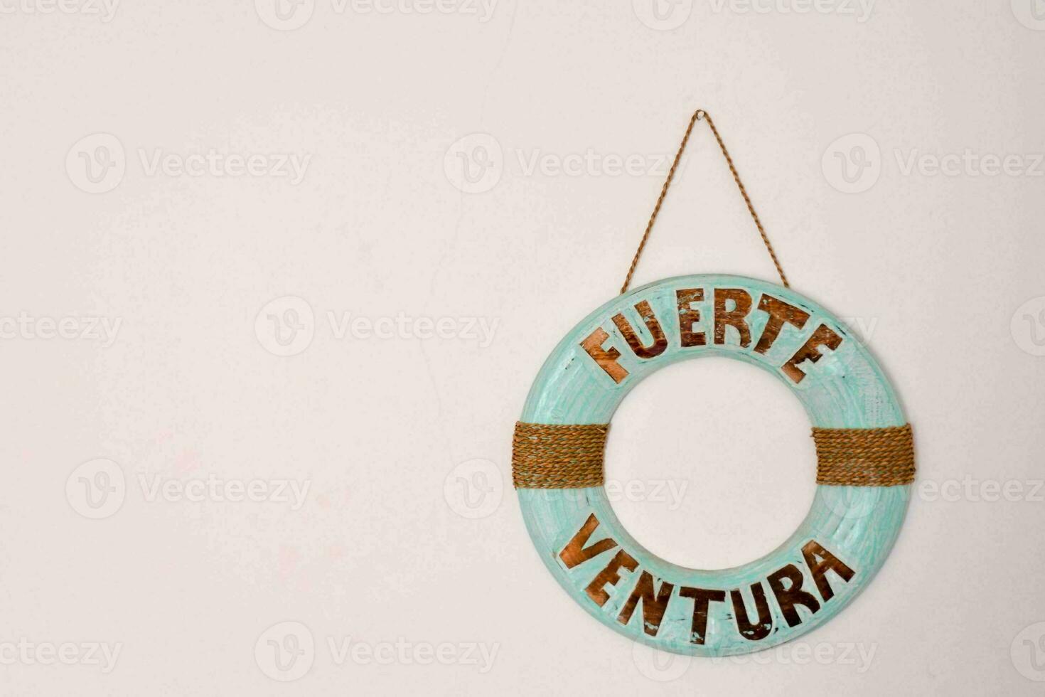 a life ring hanging on a wall photo