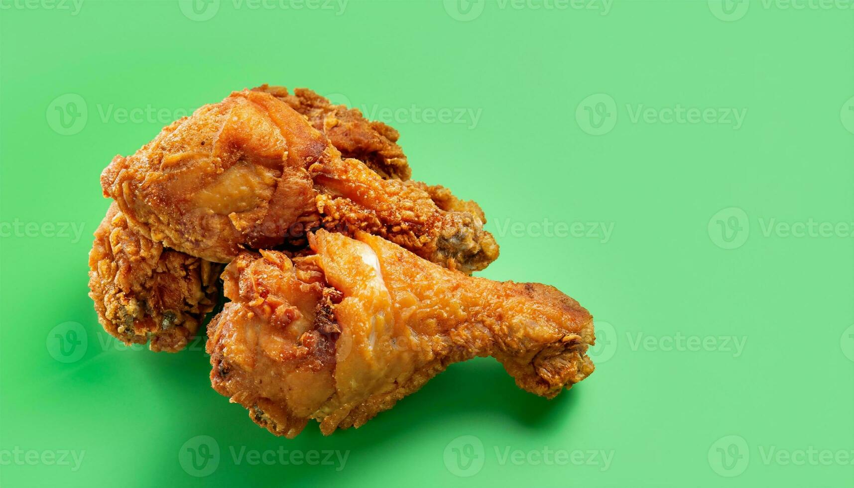 fried chicken positioned on the left with a green background Ai Generate photo