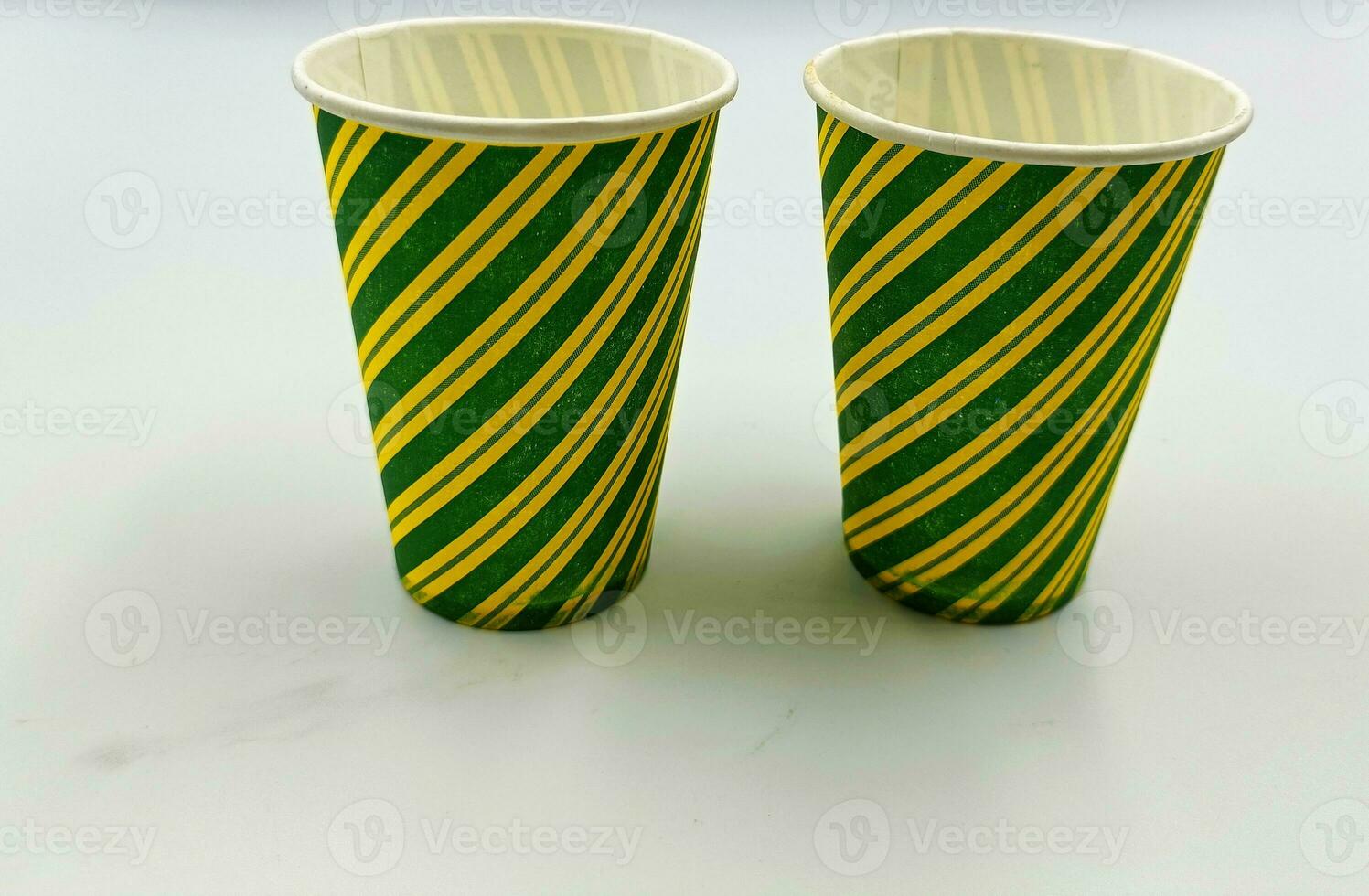 Empty PATTERN paper cups isolated on white background photo