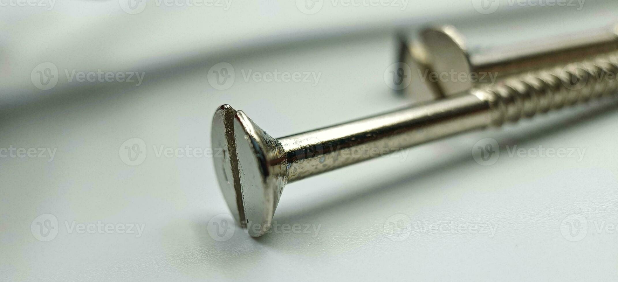 A screw from different perspectives on a white background photo