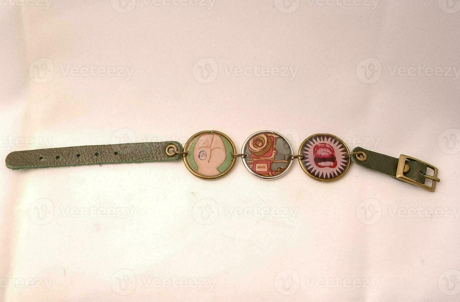 a bracelet with three different colored buttons on it photo