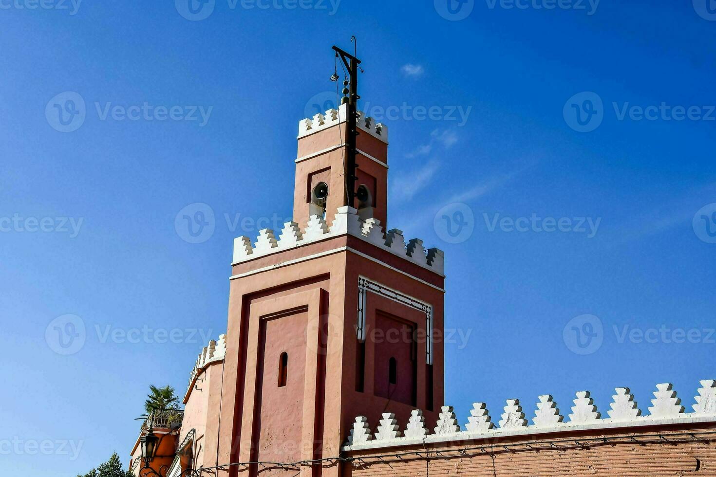 the clock tower of the mosque in marrakech photo