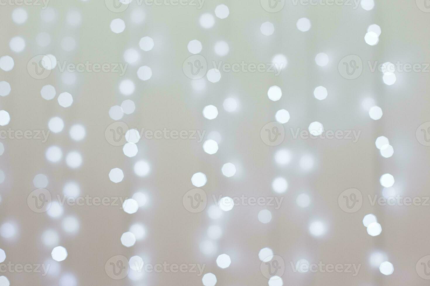 Transparent Christmas tree toy and snowflake on the background of garlands. Christmas background. Decorations for the Christmas tree. White background for new year. photo