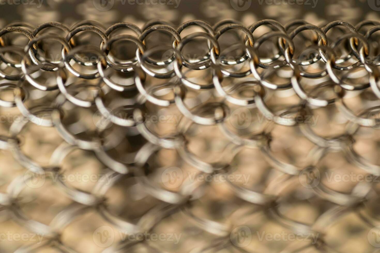 Mesh rabitz , texture of weaving mesh network link. Close up of a fence. barrier on way. metal grid close-up. rusty mesh texture photo