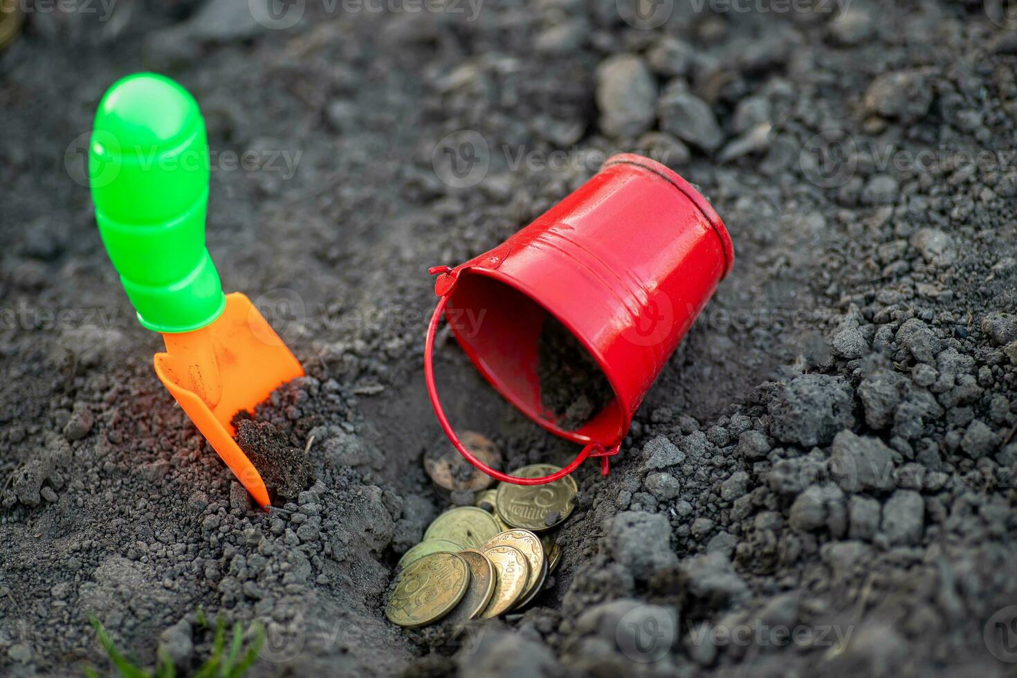 shovel and bucket of coins on ground. Earnings in agribusiness. way to make money in rural farm. Income in times of crisis. photo