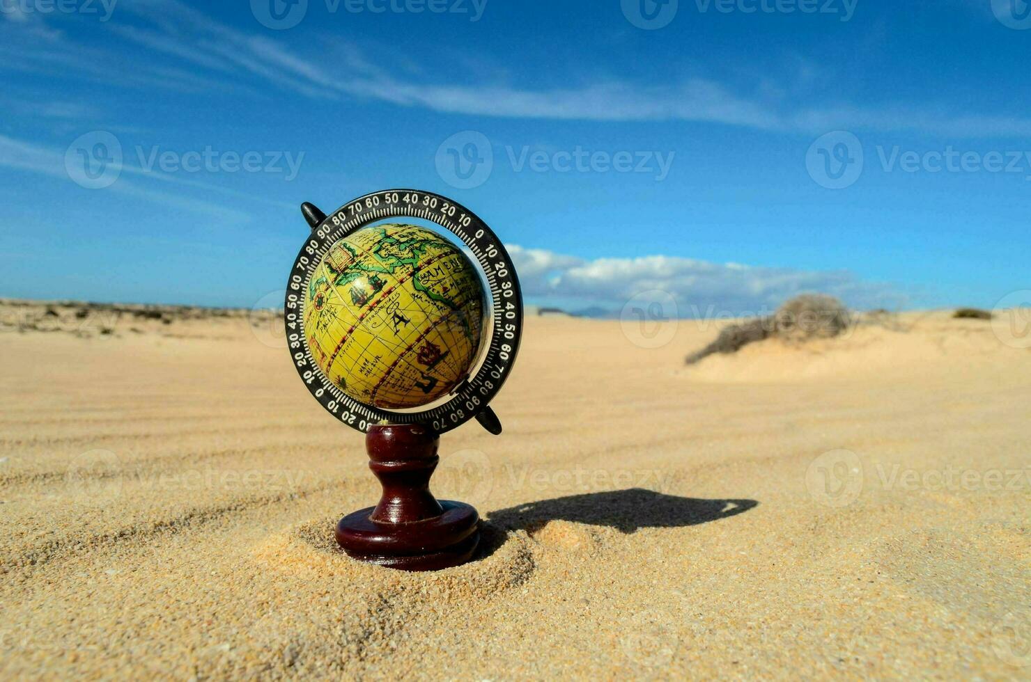 a globe in the desert photo