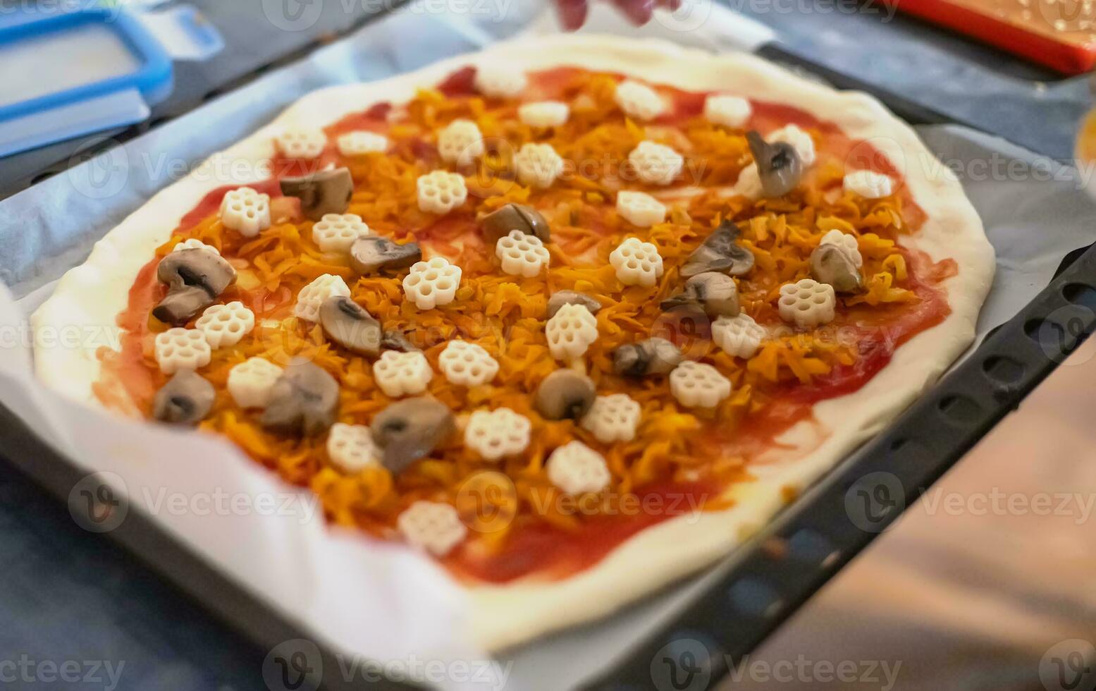 Pizza with mushrooms and pasta. Lifestyle. Home-cooked food during coronavirus epidemic. photo