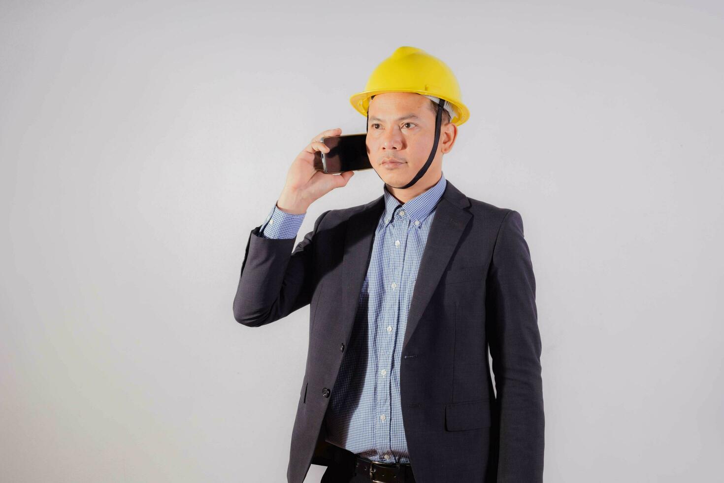 Asian male engineer on white background photo