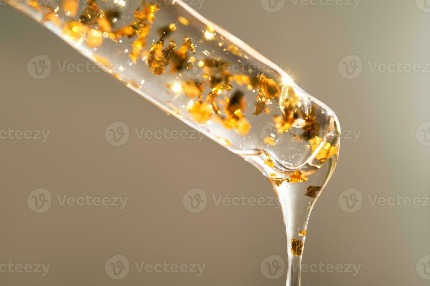 Serum pipette with 24K Gold particles. photo
