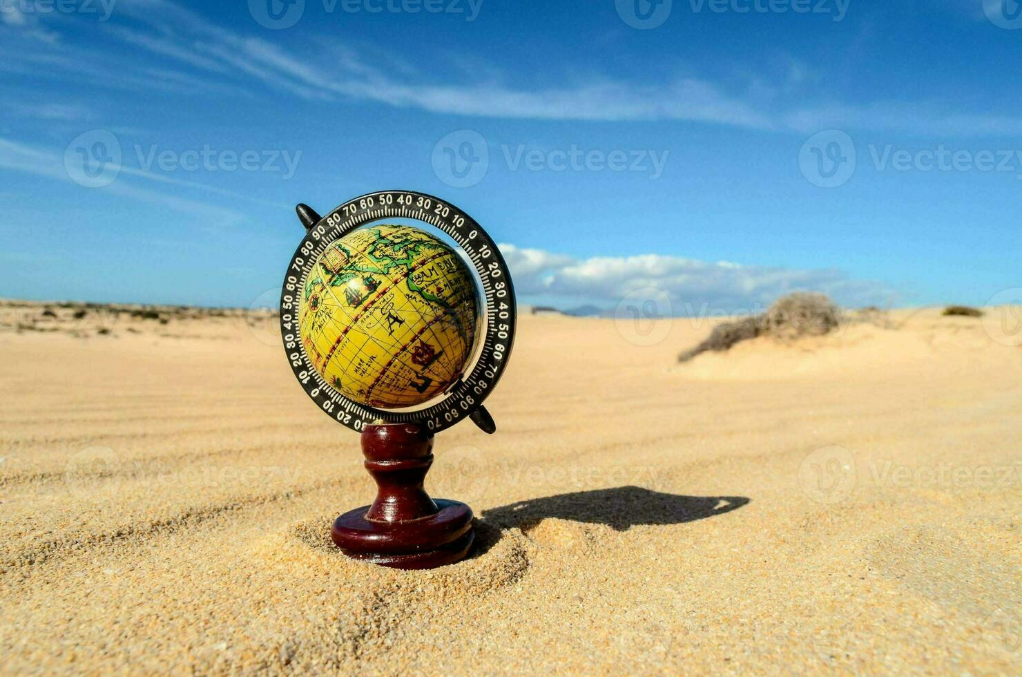 a globe in the desert photo